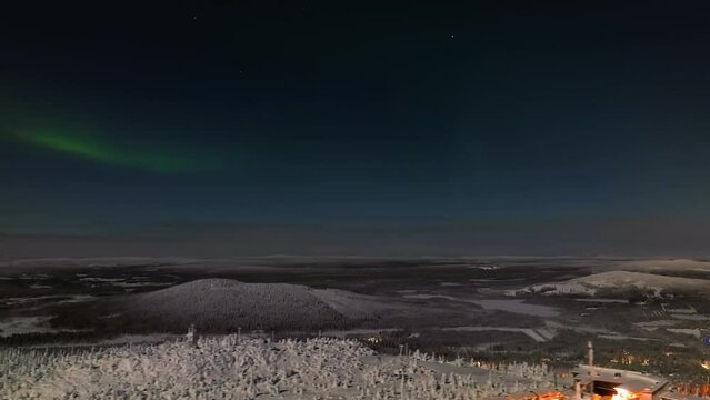 Northern lights, moon light, winter night in Lapland - aerial hyperlapse