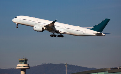 Fototapeta na wymiar Airplane takes off from airport Barcelona. High quality photo