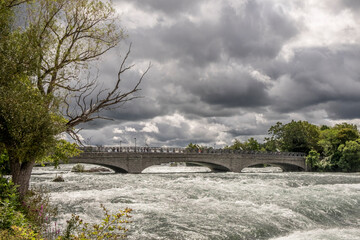 The Goat Island bridge crosses over the raging waters of the Niagara River in Niagara Falls New York USA.