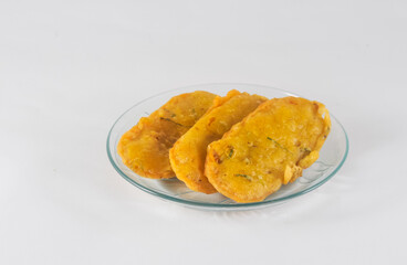 fried tempe on a plate with white background