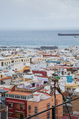 Las Palmas de Gran Canaria, colorful flat-roofed houses on overcast day