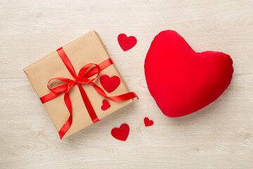 Gift boxes with soft toy on wooden background, top view