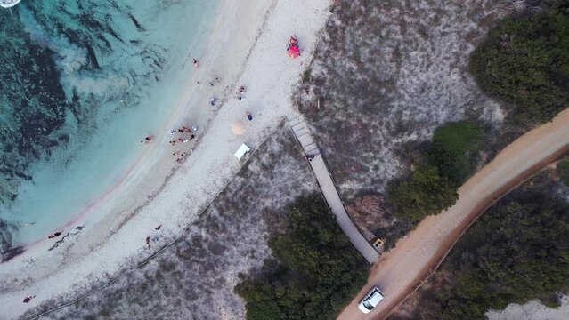 Lifeguards help revive drowned man at beach. Breathtaking aerial view flight