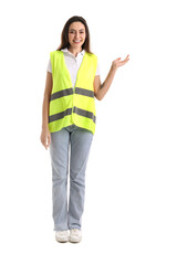 Female worker in vest showing something on white background