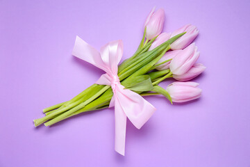 Bouquet of beautiful tulip flowers on lilac background. Women's Day celebration