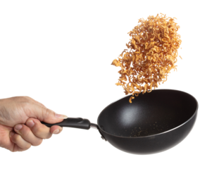 Instant Noodle fly in iron pan, yellow instant noodle float explode, abstract cloud fly. Curved dried instant noodles splash throwing in Air. White background Isolated high speed shutter, freeze