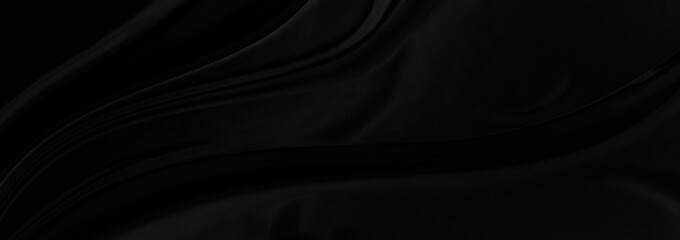 Black gray satin dark fabric texture luxurious shiny that is abstract silk cloth panorama background with patterns soft waves blur beautiful.