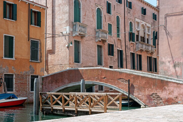 Fototapeta na wymiar Small bridge over a canal in Venice Italy.