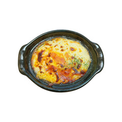 Potato gratin in black pan isolated white background