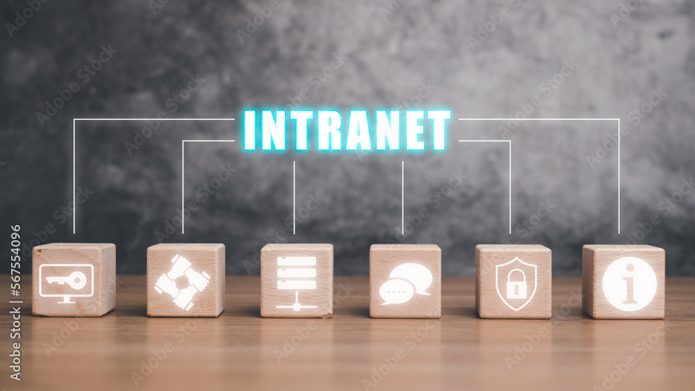 Poster intranet concept, wooden block cube on desk with intranet icon on virtual screen.