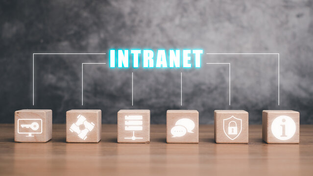 Intranet concept, Wooden block cube on desk with intranet icon on virtual screen.