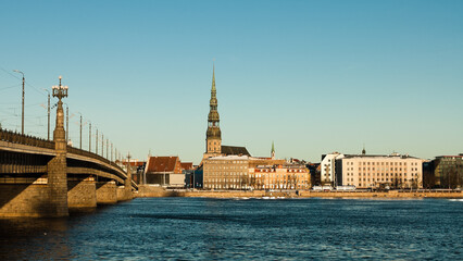 Fototapeta premium riga, panorama of the city, in the background the blue sky in the foreground is the river