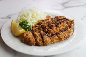Pork tonkatsu served with lettuce