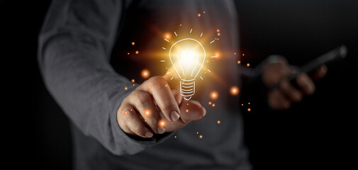 hand holding light bulb. idea concept with innovation and inspiration. Bulb light drawing idea in hand