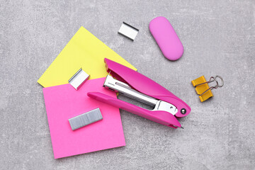 Flat lay composition with new stapler on grey table