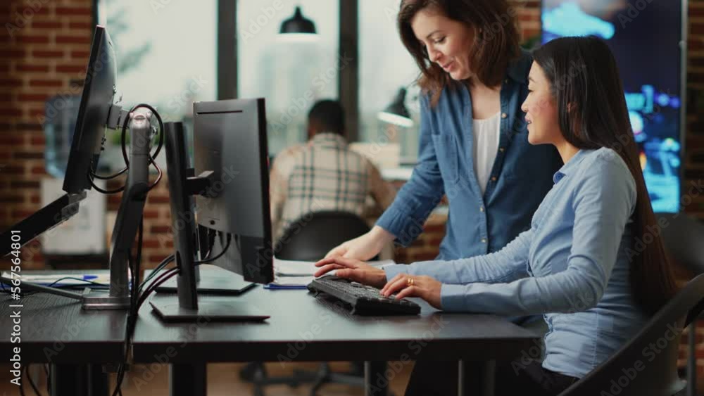 Poster female app developers working on software production with multiple displays, using computers interfa
