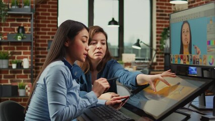 Female content creators editing professional images with retouching software and stylus pen, working on multimedia content. Diverse graphic artists processing photos using tablet and touchscreen. - Powered by Adobe