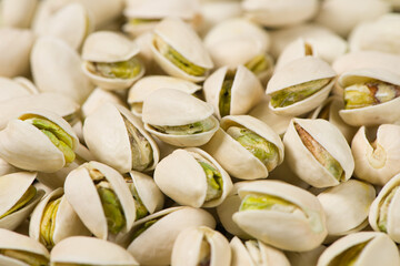 Closeup of pistachio nuts texture background. 