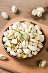Pistachio nuts on wooden table