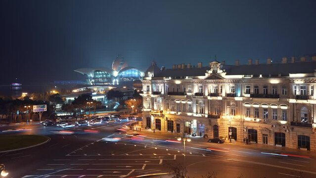 Travel to Baku. 4K night video time lapse with car traffic lights in Azneft Square from Baku, Azerbaijan.