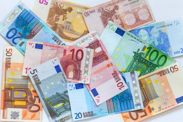 Top view of euro banknotes of different denominations. Financial business background. Concept of payment for services, market relations, loans, economy, inflation. Flat lay, closeup, mock up