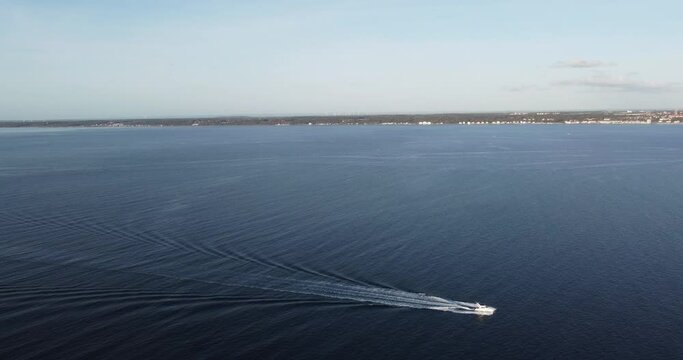 aerial view of a ship crossing the oresund strait, in front of kronborg castle with a view towards sweden
