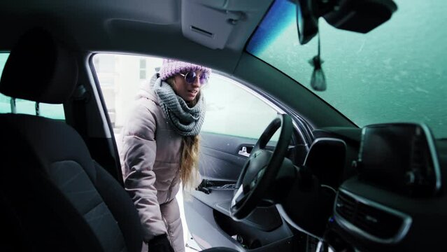 Woman In Sunglasses Peering Into Inside A Car Through The Front Door