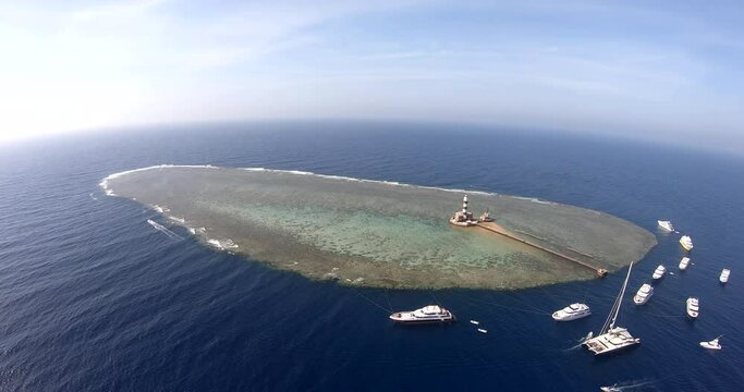 Aerial Drone Shot for the Daedalus Reef lies 180km south of Brother Islands. The reef is huge, surrounded by a sheer wall all around. shot on 4K and 50 Frames