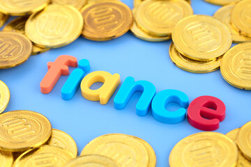 The English word fiance is surrounded by gold coins