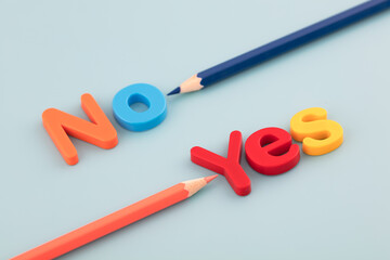 The colored pencil points to yes and no
