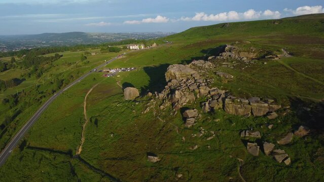 Establishing Drone Shot Rotating Around Cow and Calf Rock Formation on Ilkley Moor at Golden Hour Sunset West Yorkshire UK
