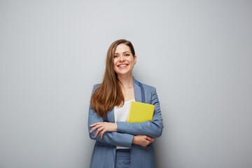 Happy teacher or smiling smiling business woman. Student girl portrait with yellow book..