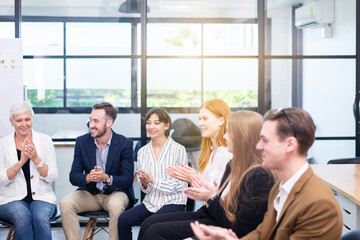 Obraz premium Business people team clapping hands and working a new project in office,Teamwork concept,Business profits