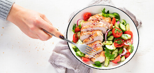 Salad with chicken meat. Fresh vegetable salad with chicken breast. Meat salad with chicken fillet and fresh vegetables on plate.