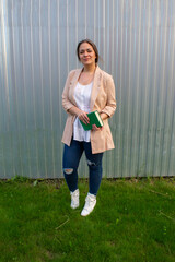 young beautiful woman in a jacket and jeans