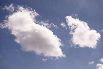 Fototapeta na wymiar White clouds in the blue sky.