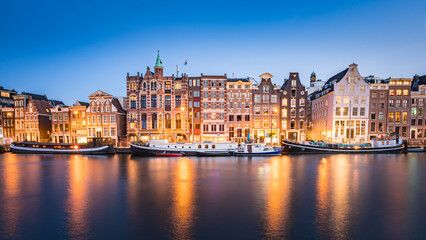 Fototapeta na wymiar Amsterdam Canals with bridge and dutch houses, Netherlands
