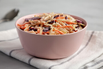 Homemade Classic Southern Coleslaw in a pink Bowl, side view. Close-up.