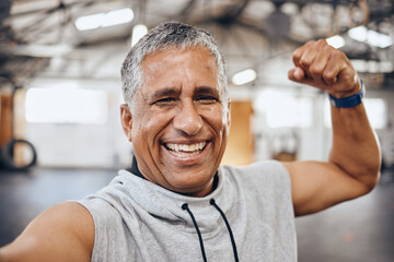 Muscle, exercise and selfie portrait of old man in gym show biceps for motivation, wellness and...