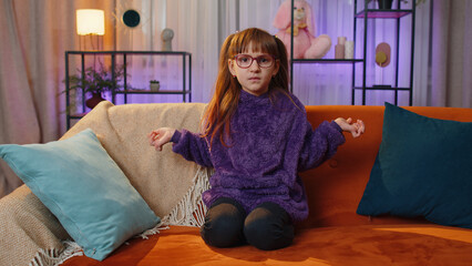 What. Why. Toddler girl raising hands in indignant expression, asking reason of failure,...