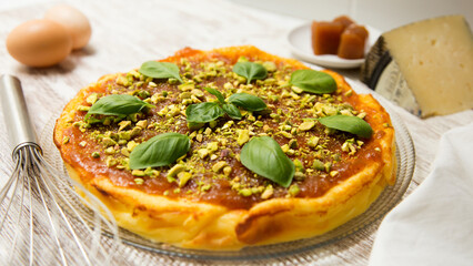 Cheesecake with quince jelly and pistachio.