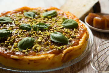 Cheesecake with quince jelly and pistachio.