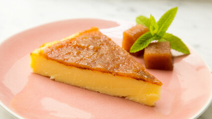 Cheesecake with quince jelly and pistachio.