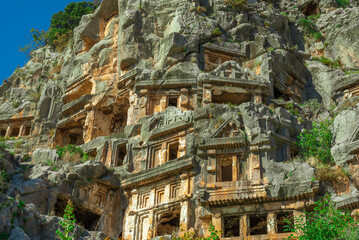 Fototapeta premium Ruins of Rock-cut tombs in ancient Lycian city of Myra. Lycian way, Demre, Antalya province, Turkey.