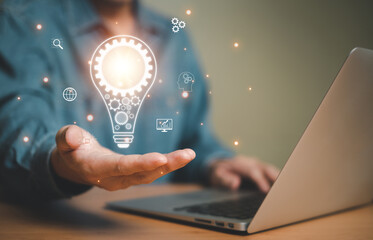 Business person dress in formal suit holding an icon that show the component of Business that do digital transformation and AI technology for industrial or marketing business.