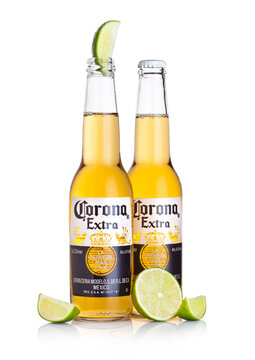LONDON, UK - MARCH 10, 2018 : Bottles of Corona Extra Beer with lime slice on white.Corona is the most popular imported beer in the US.