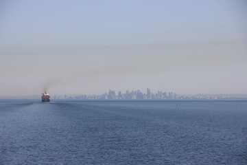 Sailing on Port Phillip Bay towards the city of Melbourne, Victoria, Australia.