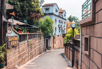 The romantic walkways in Gulangyu island during the day. The Chinese Characters in the picture was...