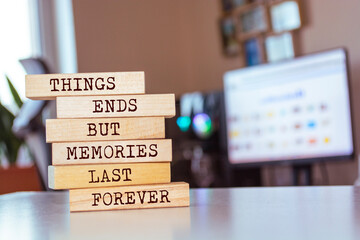 Wooden blocks with words 'Things Ends but Memories Last Forever'.