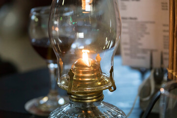 Fototapeta na wymiar vintage kerosene lamp on the restaurant table 